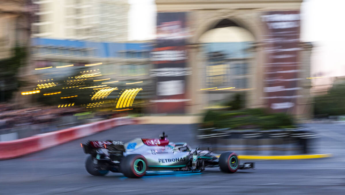 George Russell turns into the Paris while racing down the Strip during the Formula One Las Vega ...