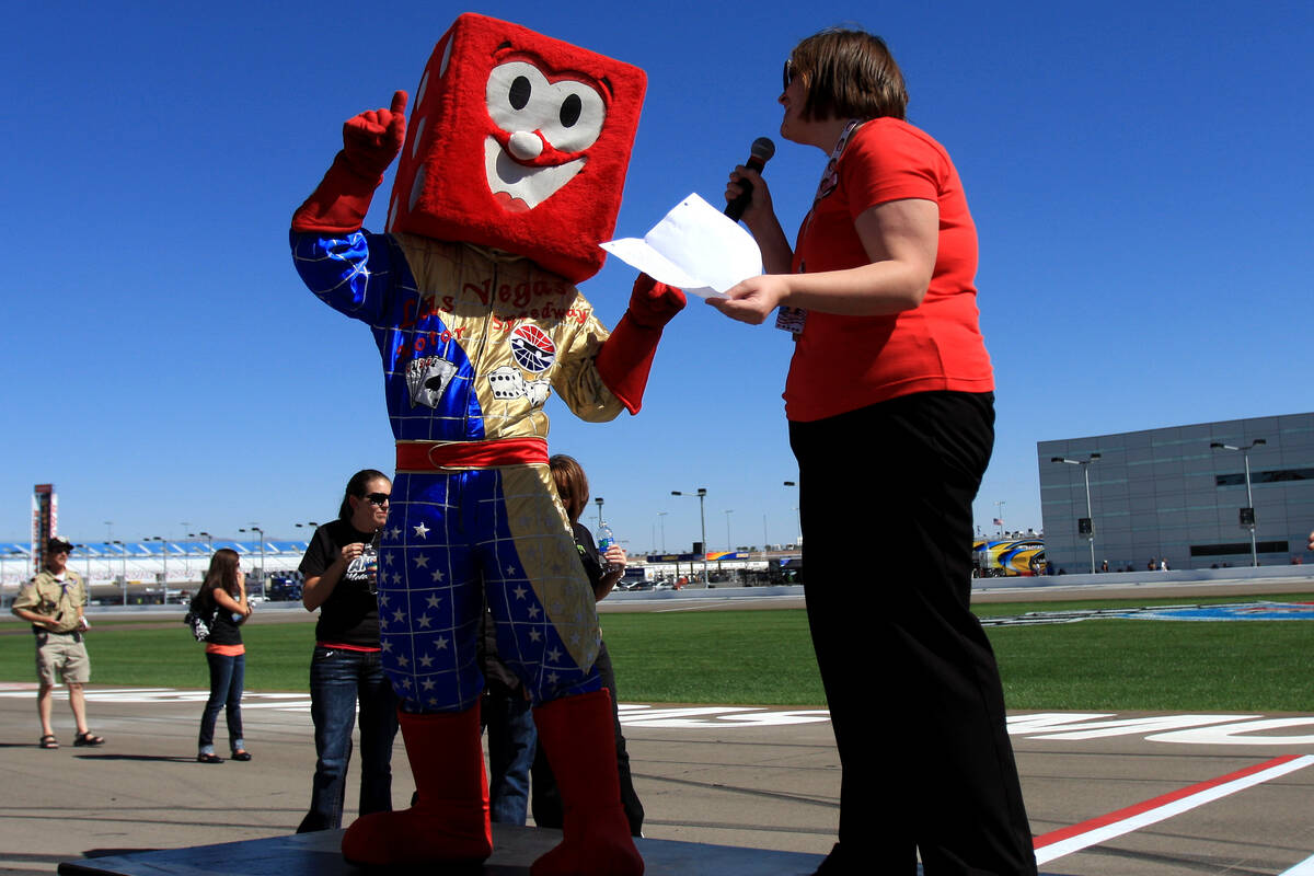 Rachel Commeford, former director of the Speedway Children's Charities, left, talks with Pit Bo ...
