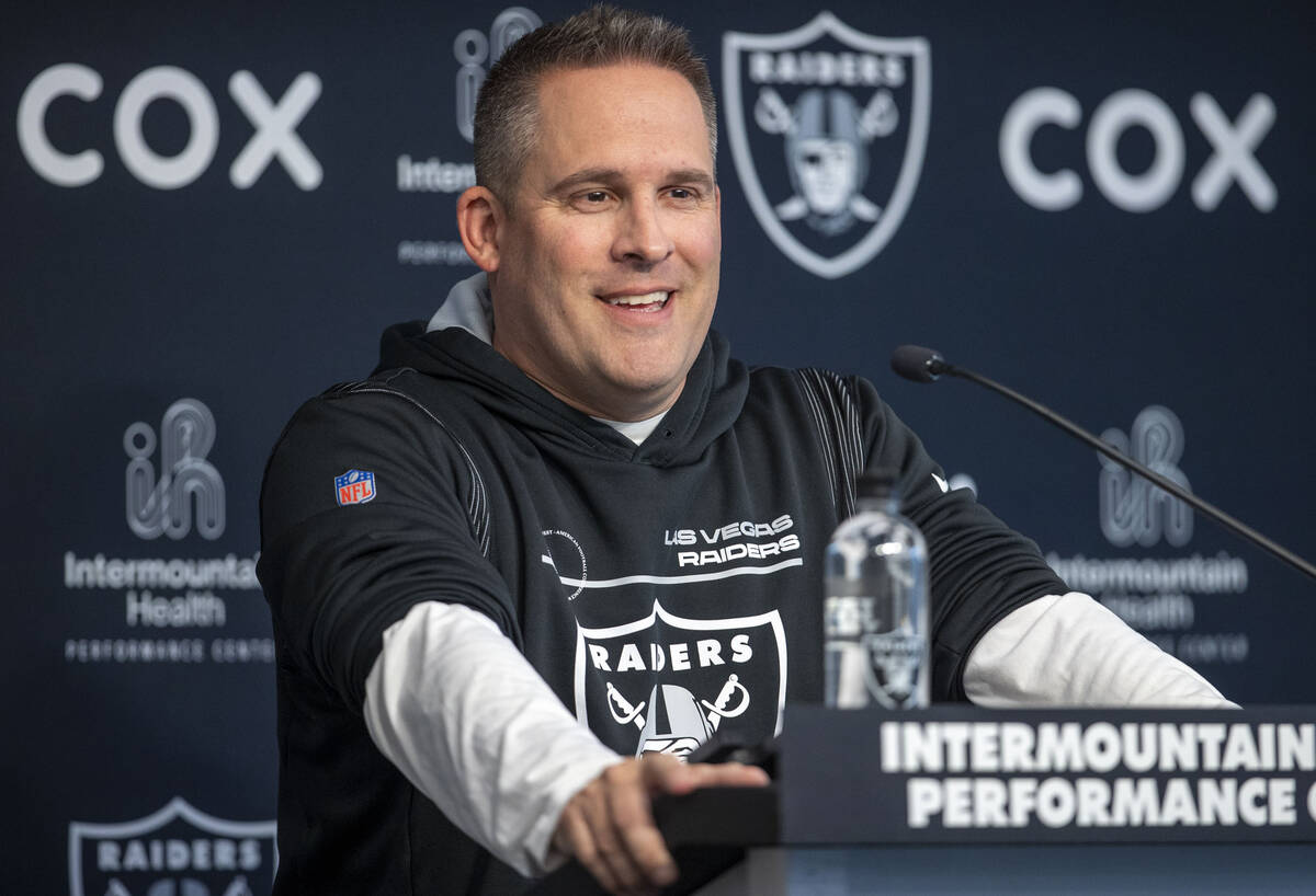 Raiders head coach Josh McDaniels smiles during a news conference at the Intermountain Health P ...