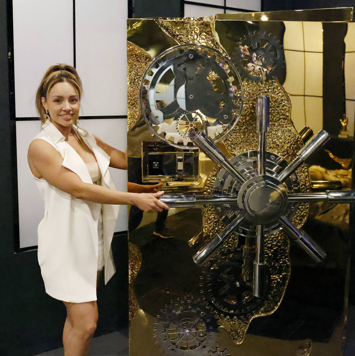 Denise Crosta, owner of Sanctuary Furniture, poses for a photo next to a vault at her Las Vegas ...