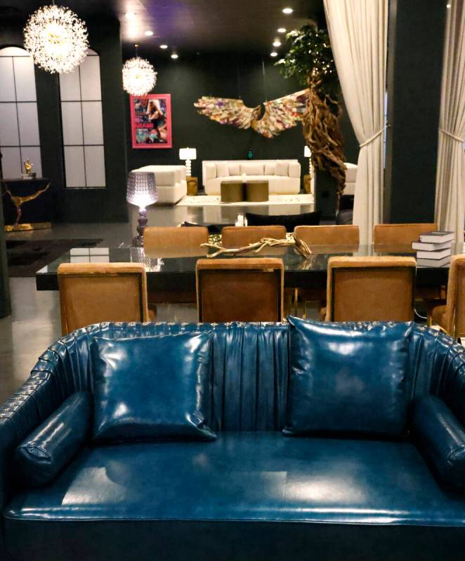 Dining table and a leather sofa is displayed at Sanctuary Furniture, on Thursday, May 25, 2023, ...