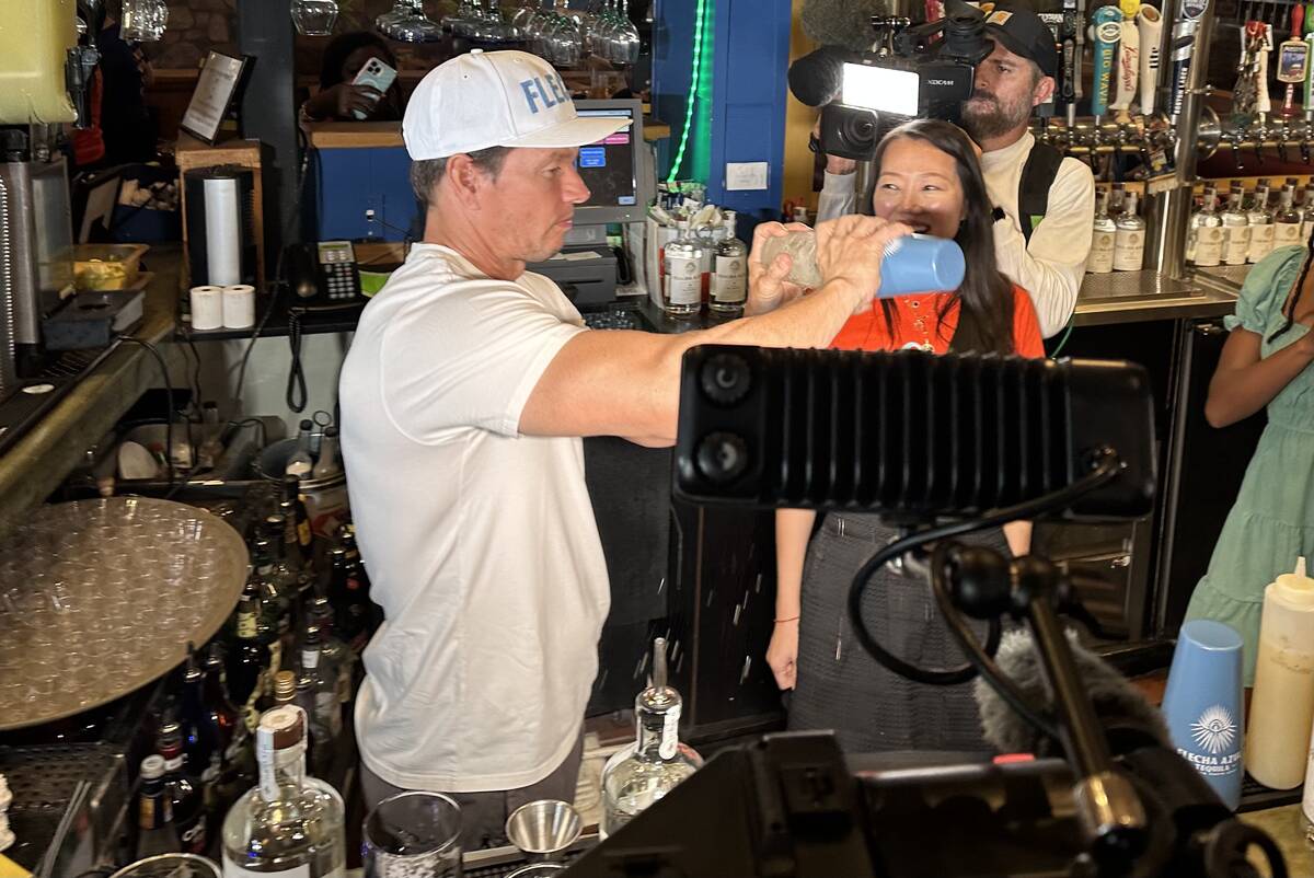 Mark Wahlberg tends bar and pours Flecha Azul tequila shots during an appearance at On The Bord ...