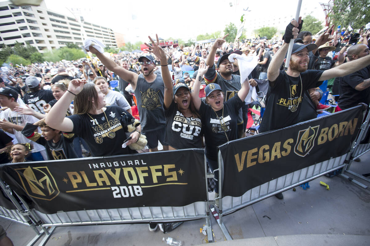 Golden Knights fans celebrate after the Knights defeated the Winnipeg Jets 2-1 during a watch p ...
