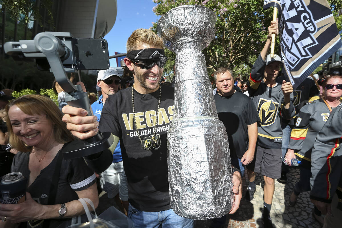 Vegas Golden Knights fan Brandon Laubhan holds a make shift Stanley Cup before Game 1 of the NH ...