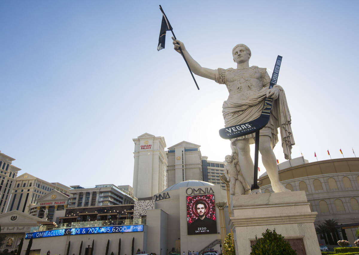 A statue of Julius Caesar is seen adorned with a Golden Knights flag and hockey stick outside o ...