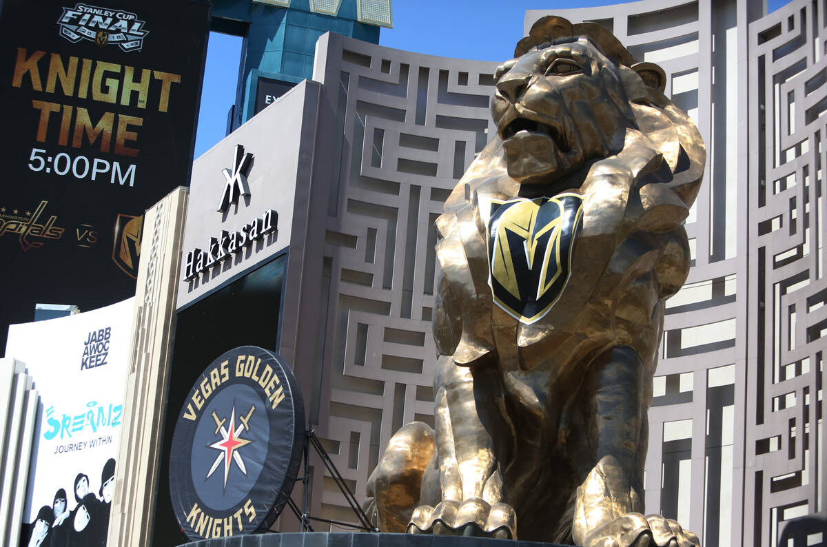 A giant puck promoting the Vegas Golden Knights is displayed outside the MGM Grand next to Leo ...
