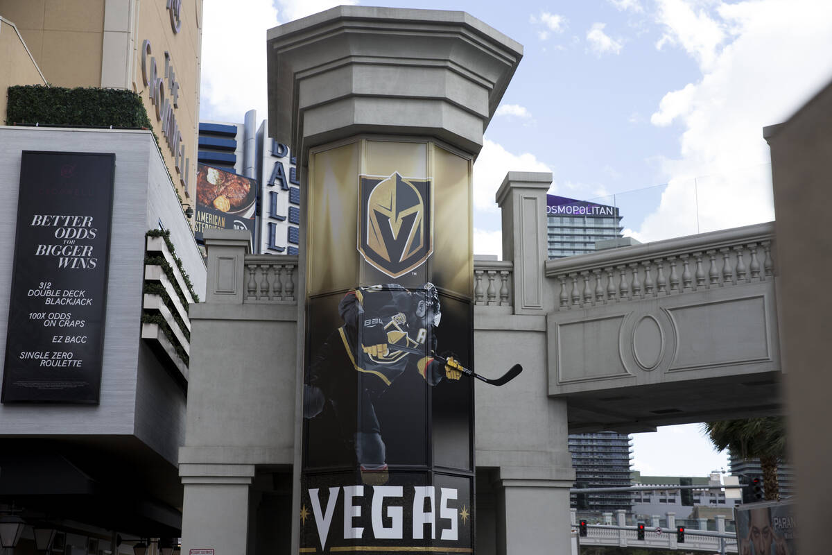 A Vegas Golden Knights banner on a pedestrian bridge at the intersection of Flamingo Road and L ...