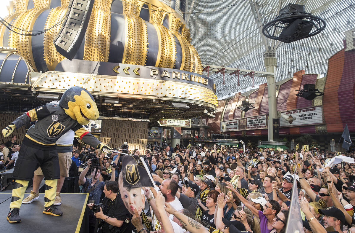 Golden Knights mascot Chance, left, entertains the crowd during "Stick Salute to Vegas and ...