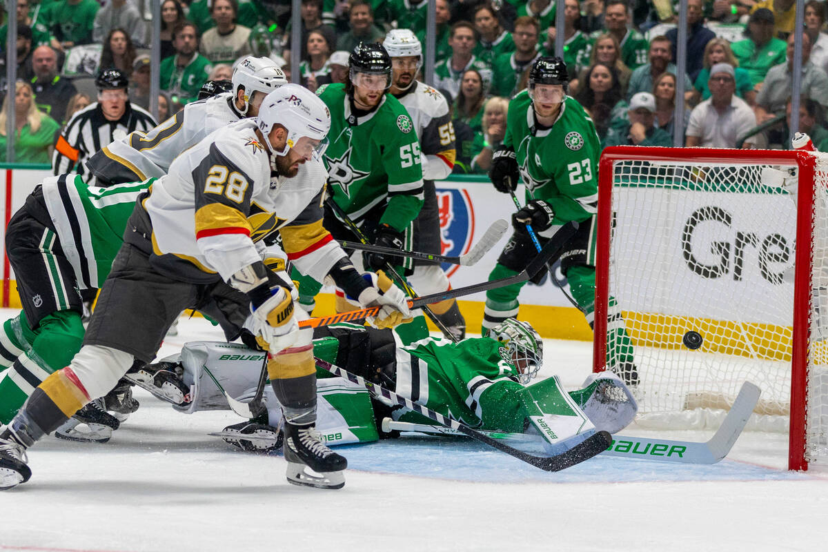 Golden Knights left wing William Carrier (28) shoots past Dallas Stars goaltender Jake Oettinge ...