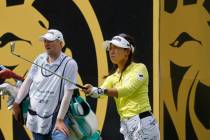 Jenny Shin of Korea watches her tee shot on the 13th hole during the second day of round-robin ...