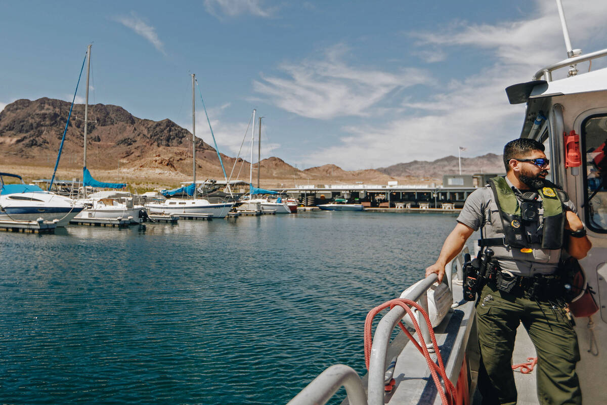 Ranger Alberto Flores stands off to the side of a National Park Service boat on Wednesday, May ...