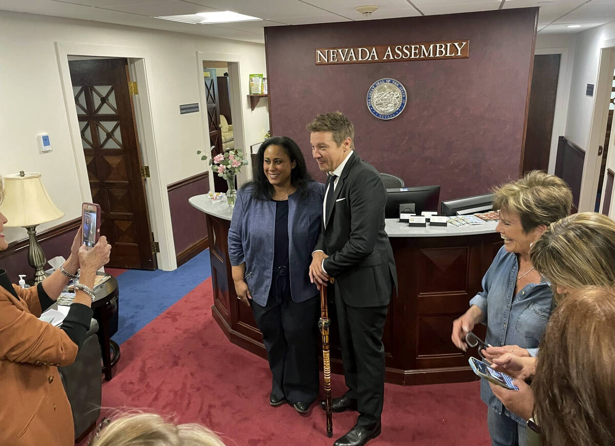 Actor Jeremy Renner poses for a photo with Democratic Assemblywoman Brittney Miller in Carson C ...