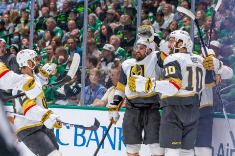 Golden Knights players celebrate a goal against the Dallas Stars in the first period during Gam ...