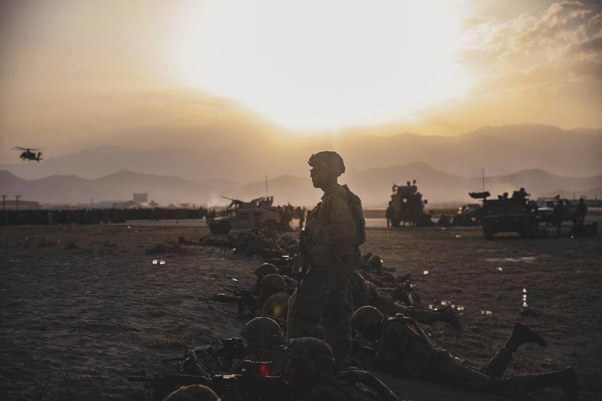 U.S. Army Soldiers assigned to the 10th Mountain Division stand security at Hamid Karzai Intern ...
