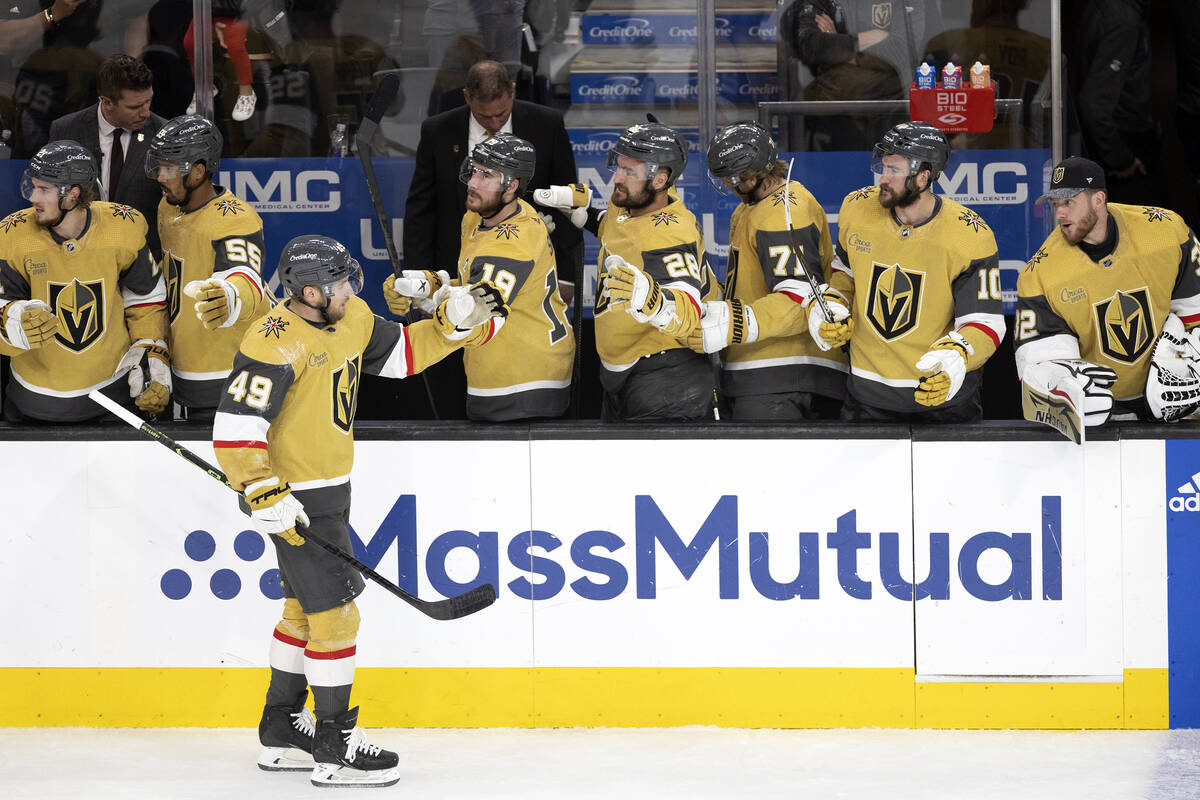 Golden Knights center Ivan Barbashev (49) is congratulated by the bench after he scored during ...