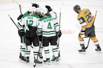 The Dallas Stars celebrate after center Luke Glendening (11) scored while Golden Knights left w ...