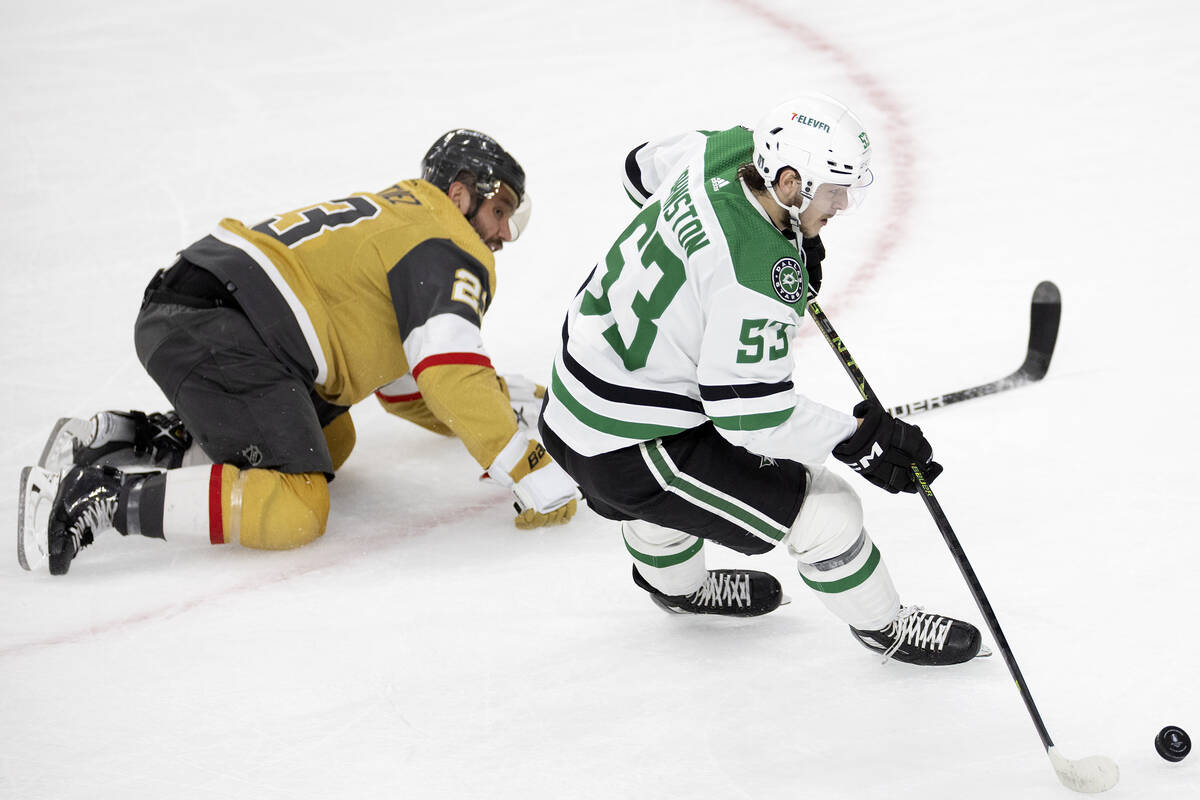 Golden Knights defenseman Alec Martinez (23) falls to the ice while skating against Dallas Star ...