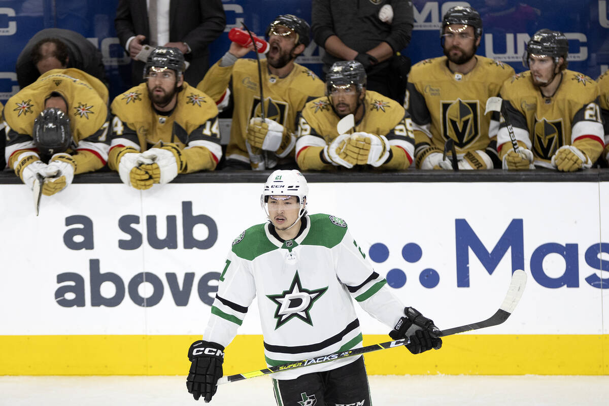 Dallas Stars left wing Jason Robertson (21) skates past the Golden Knights bench after he score ...