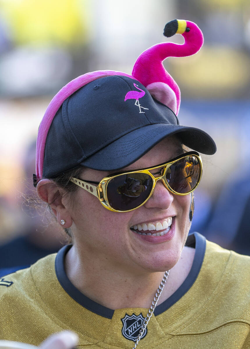 Golden Knights fan Louisa Moore sports a flamingo hate to complete the ensemble outside before ...