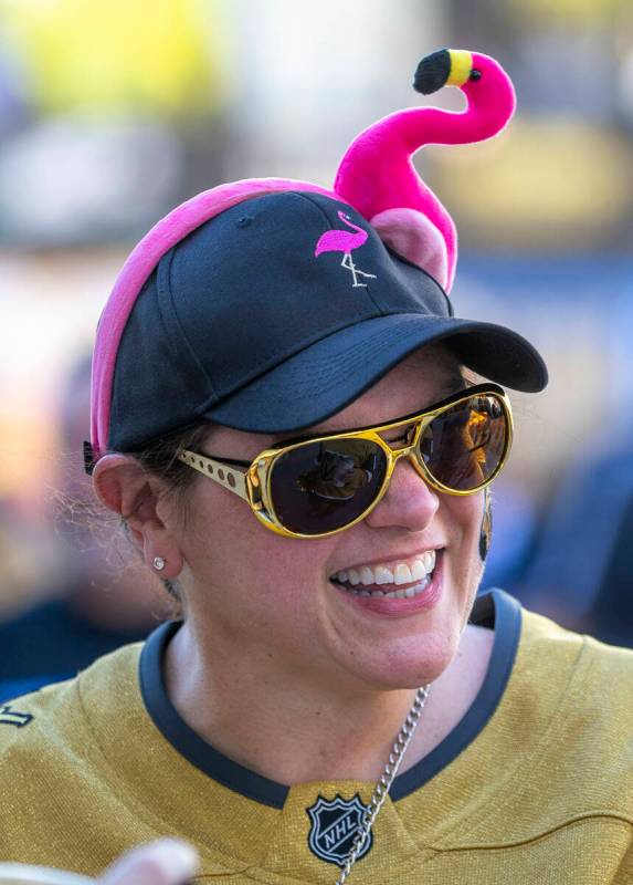 Golden Knights fan Louisa Moore sports a flamingo hate to complete the ensemble outside before ...