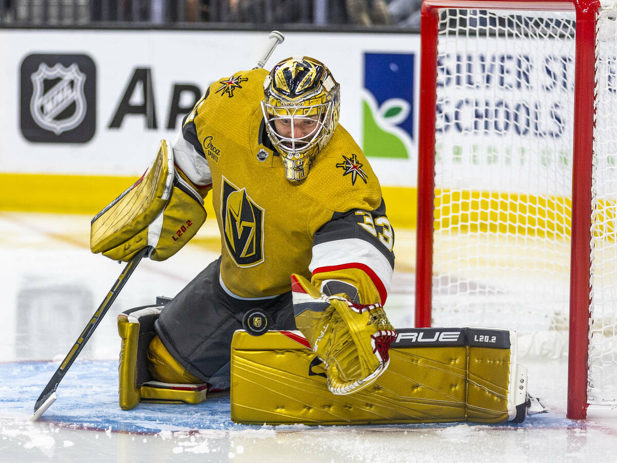 Golden Knights goaltender Adin Hill (33) reaches for another shot on goal by the Dallas Stars i ...
