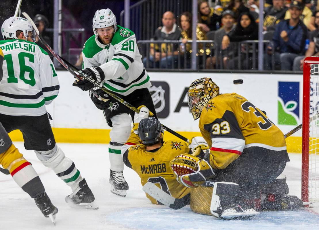 Dallas Stars defenseman Ryan Suter (20) scores against Golden Knights goaltender Adin Hill (33) ...