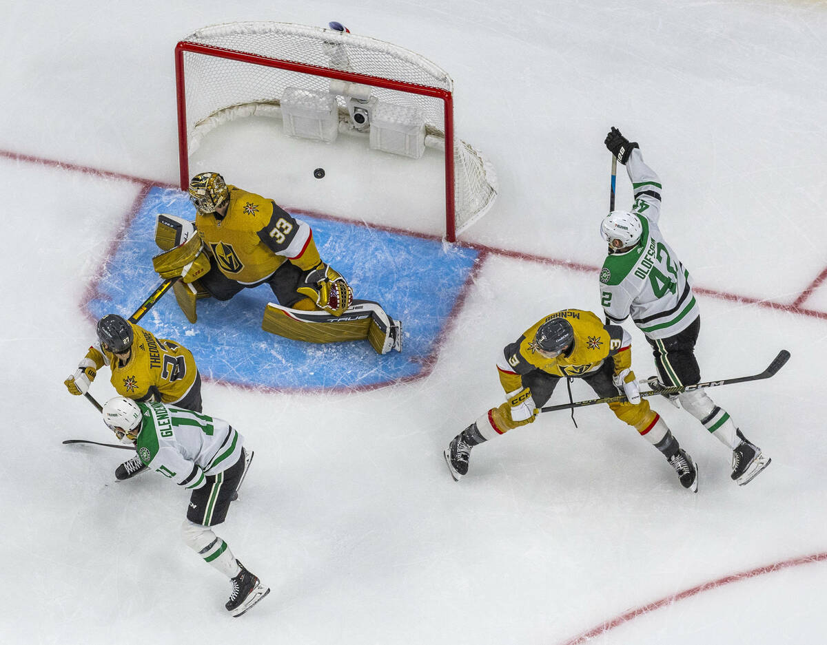 Golden Knights goaltender Adin Hill (33) looks back as the puck enters the net as the Dallas St ...