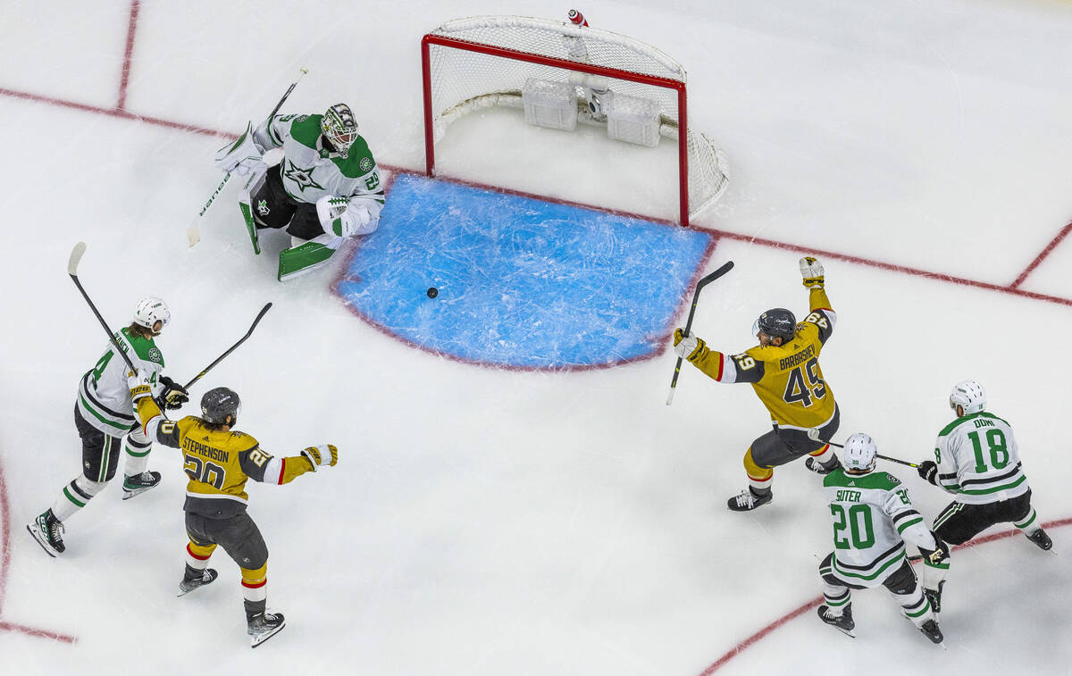 Golden Knights center Chandler Stephenson (20) and center Ivan Barbashev (49) celebrate a goal ...
