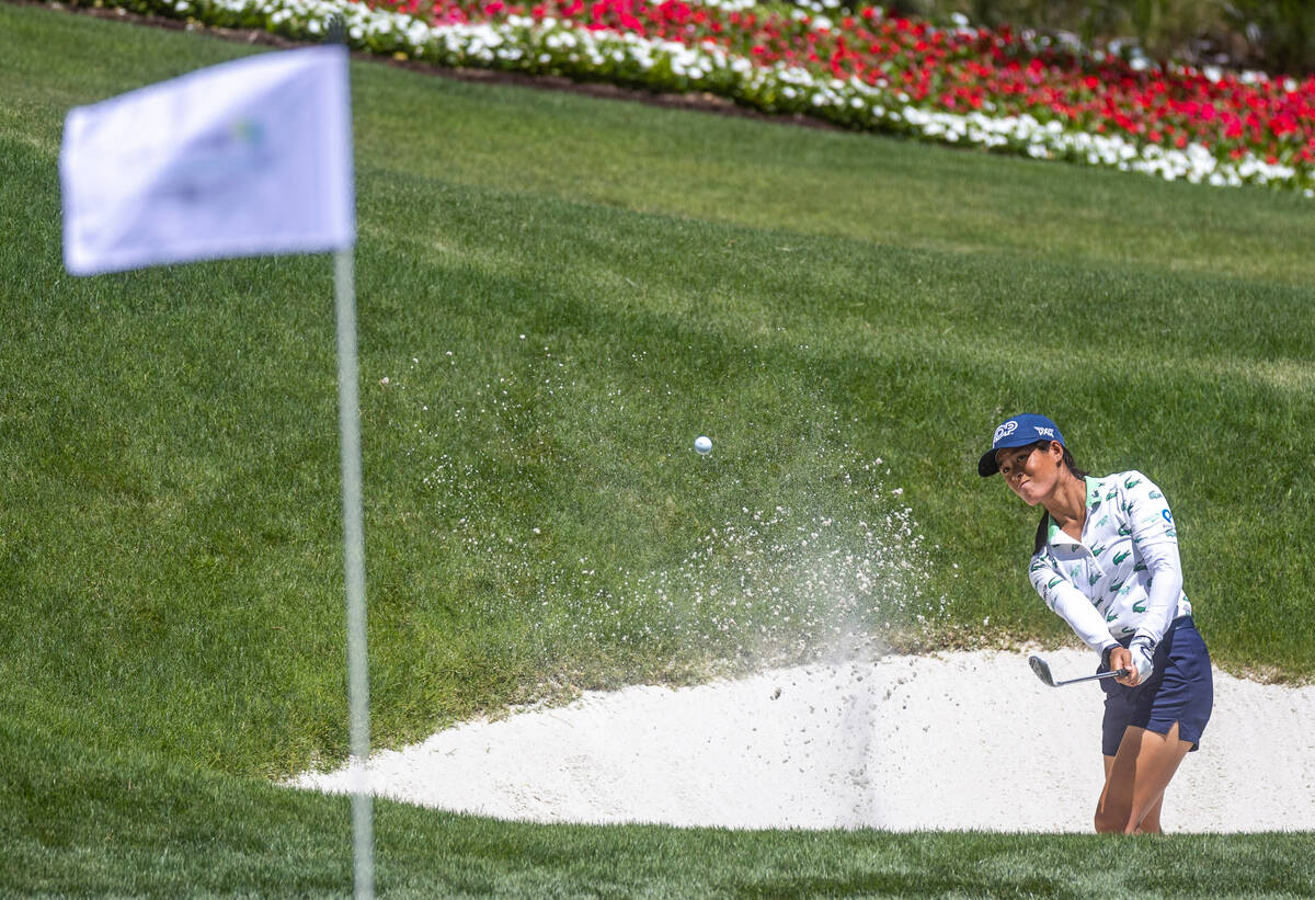 Celine Boutier wedges out of the sand onto the green at hole 9 during the third day of Bank of ...