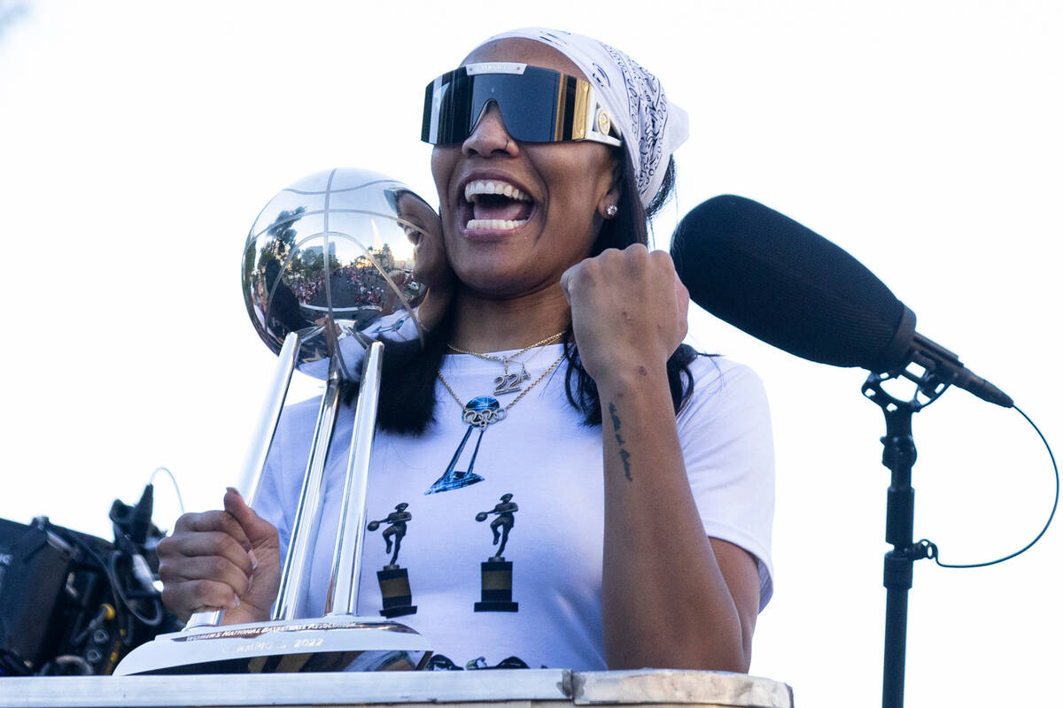 Las Vegas Aces' A'ja Wilson holds up the championship trophy during the team's WNBA Championshi ...