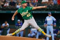 Oakland Athletics starting pitcher Chris Bassitt throws against the Texas Rangers during the fi ...