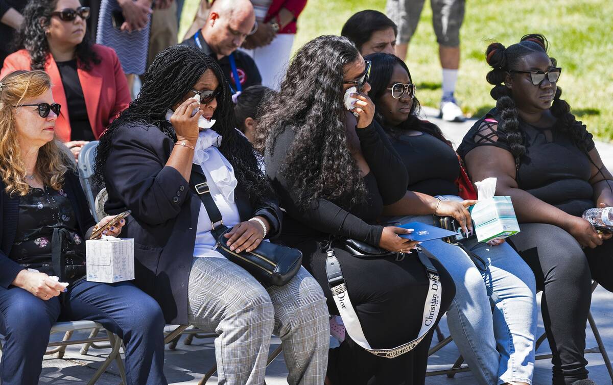 Micah King, center, a daughter of Sharon Savage, her sisters Arrianna, second right, and Nia, r ...
