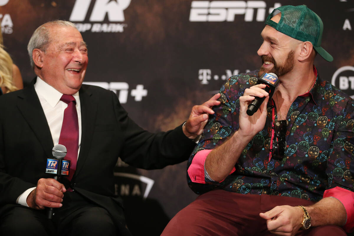 Boxing promoter Bob Arum, left, and Tyson Fury, share a laugh during a press conference at the ...