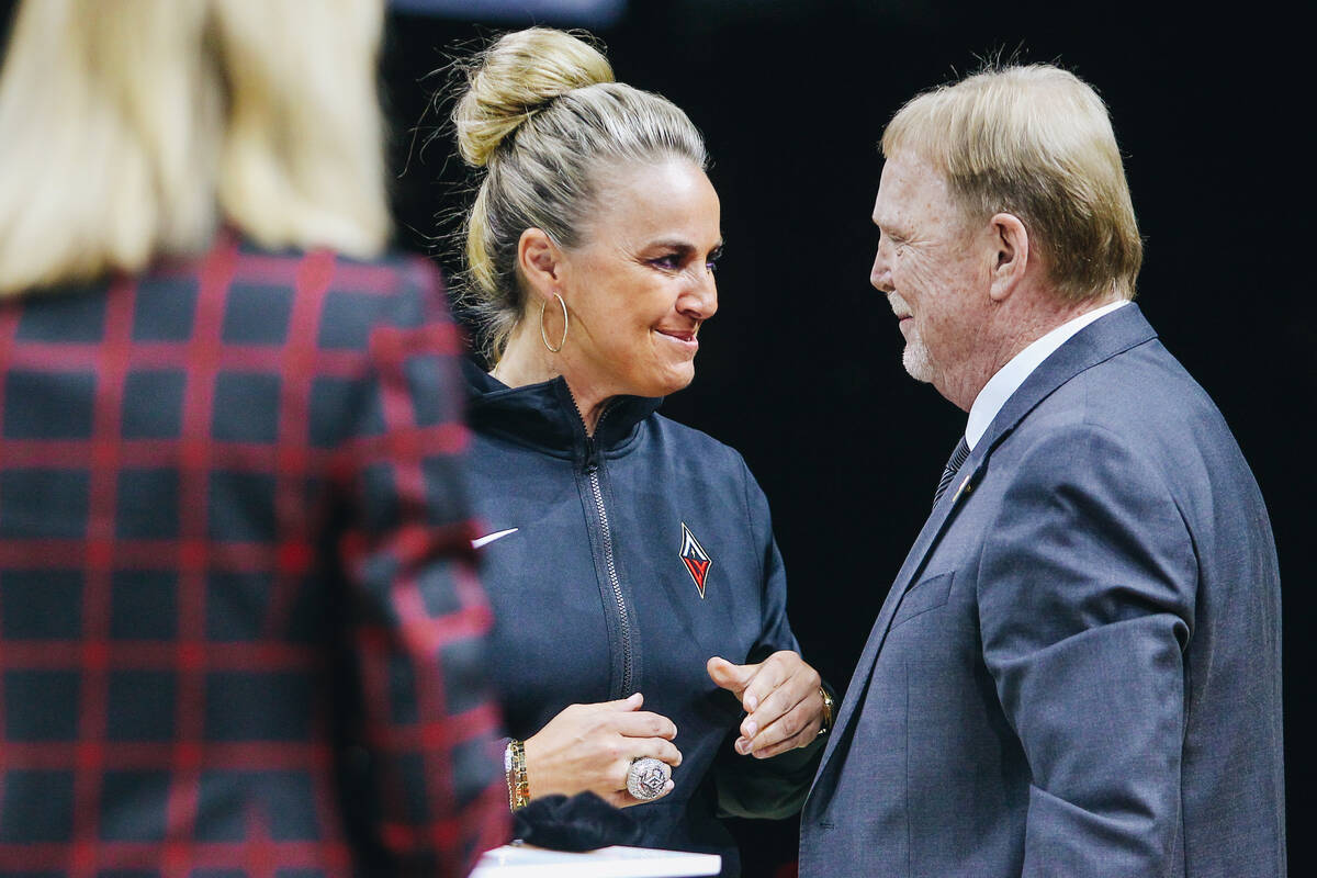 Becky Hammon receives her championship ring from Las Vegas Aces owner Mark Davis on Saturday, M ...