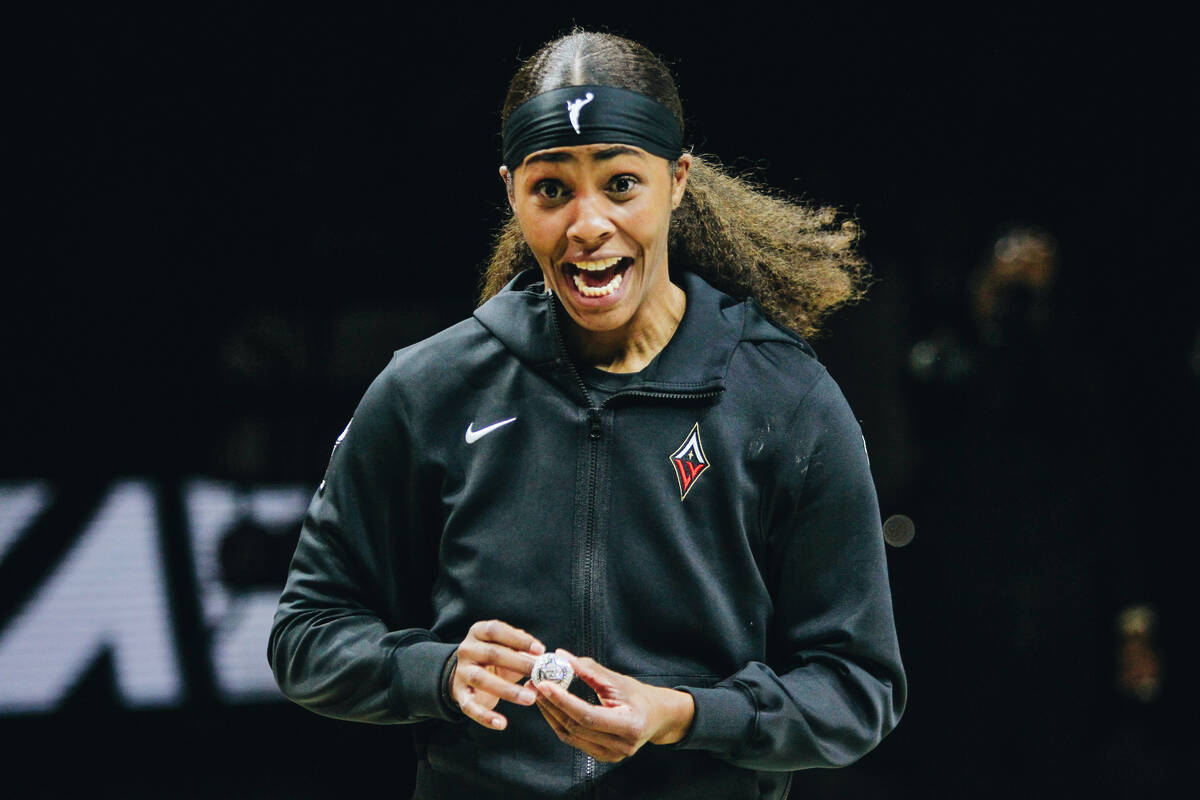 Aces guard Sydney Colson gets excited after receiving her championship ring on Saturday, May 27 ...