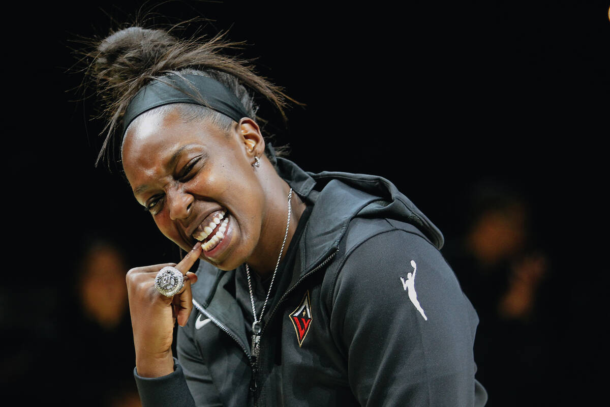 Las Vegas Aces guard Chelsea Gray poses with her championship ring on Saturday, May 27, 2023, a ...