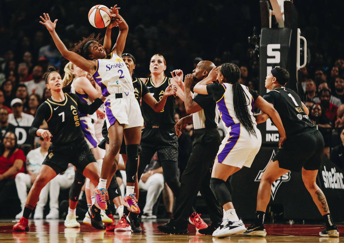 Los Angeles Sparks guard Nia Clouden (2) reaches for the ball during a tip off on Saturday, May ...