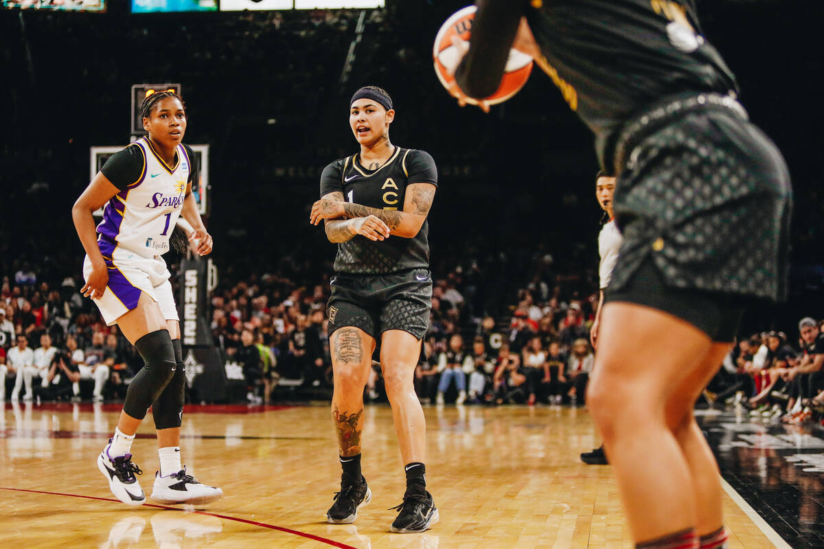 Las Vegas Aces forward Kierstan Bell (1) throws the ball to teammate Alysha Clark (7) during a ...