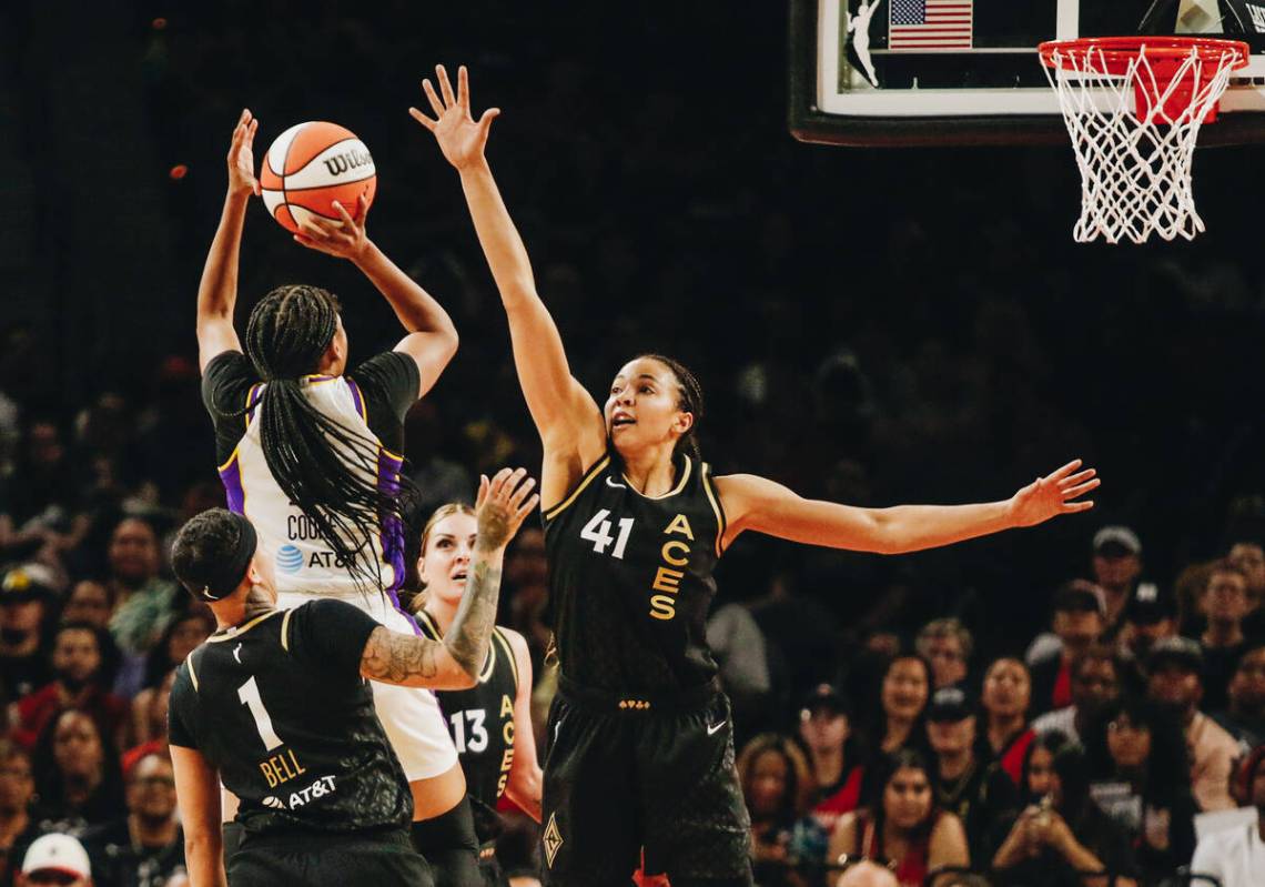 Los Angeles Sparks guard Zia Cooke (1) attempts a jump shot as La Vegas Aces center Kia Stokes ...