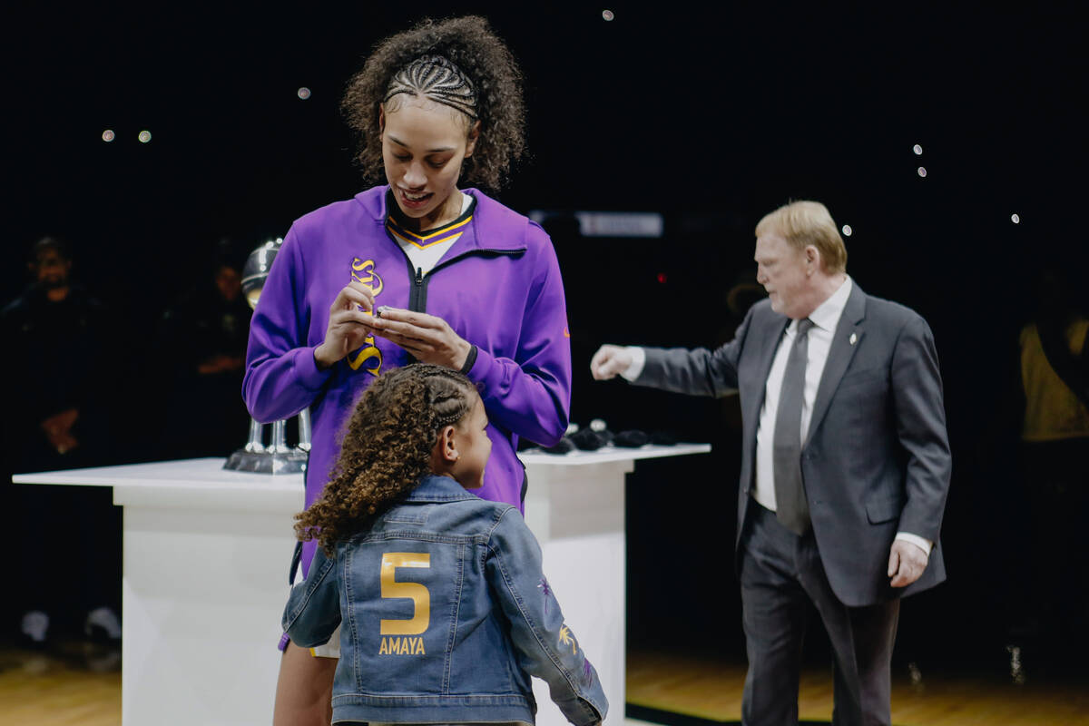 Los Angeles Sparks forward Dearica Hamby receives her championship ring from her former team, t ...