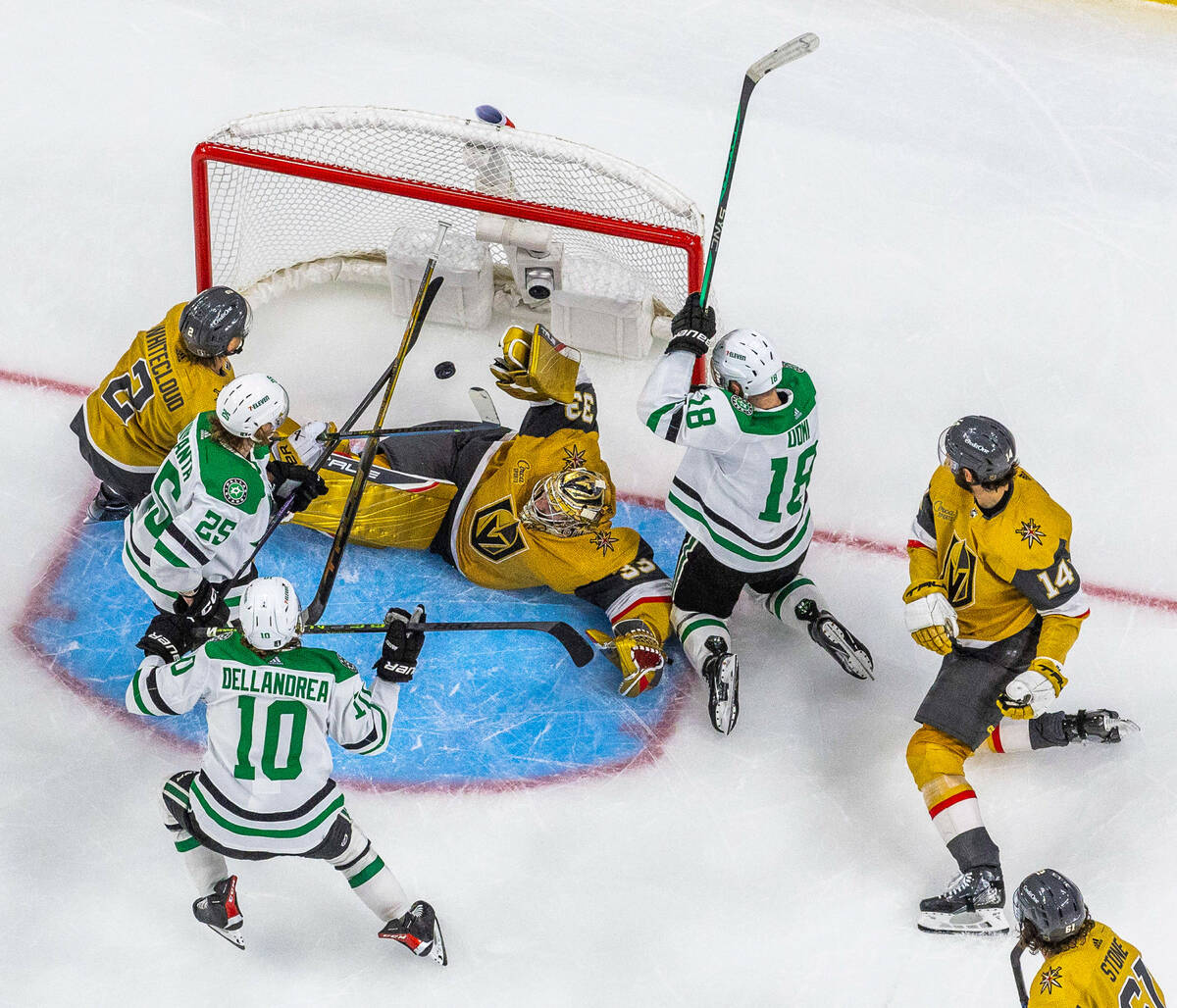 Golden Knights goaltender Adin Hill (33) is unable to stop a goal by Dallas Stars center Ty Del ...
