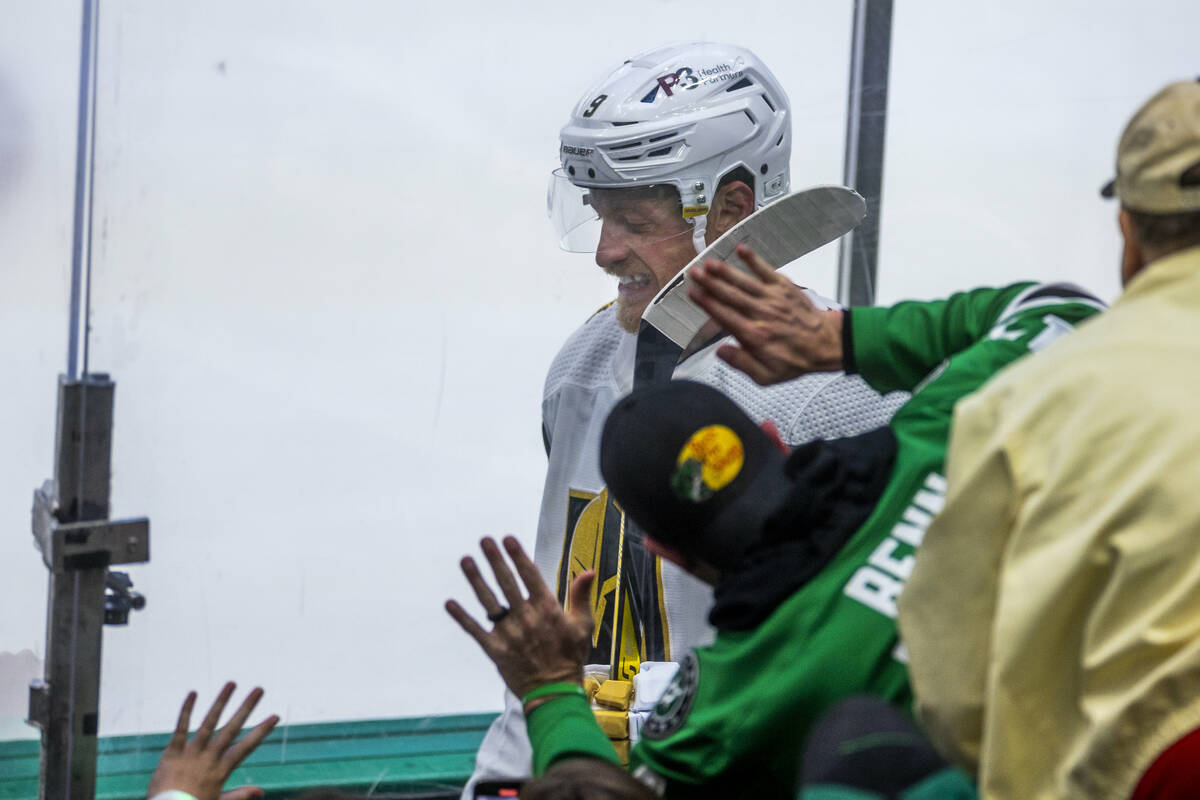 Golden Knights center Jack Eichel (9) is harassed by Dallas Stars fans on the way to the penalt ...