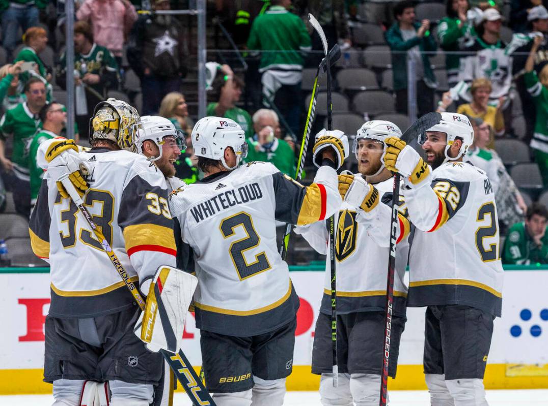 Golden Knights players celebrate on the ice after defeating the Dallas Stars 6-0 during Game 6 ...