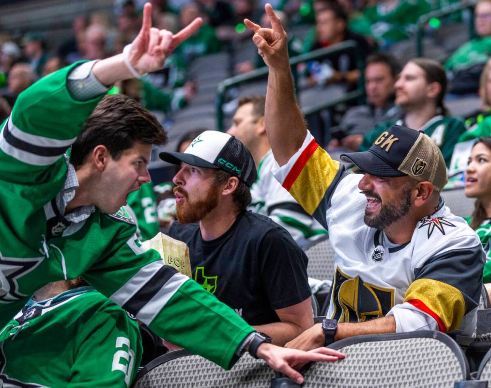 A Golden Knights fan and Dallas Stars fan have a cheer off during the third period in Game 6 of ...