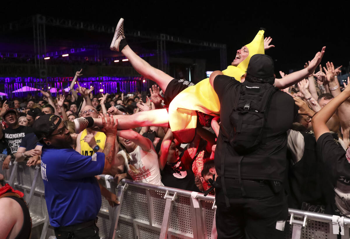 A fan in a banana suit crowd surfs during the Punk Rock Bowling music festival on Saturday, May ...