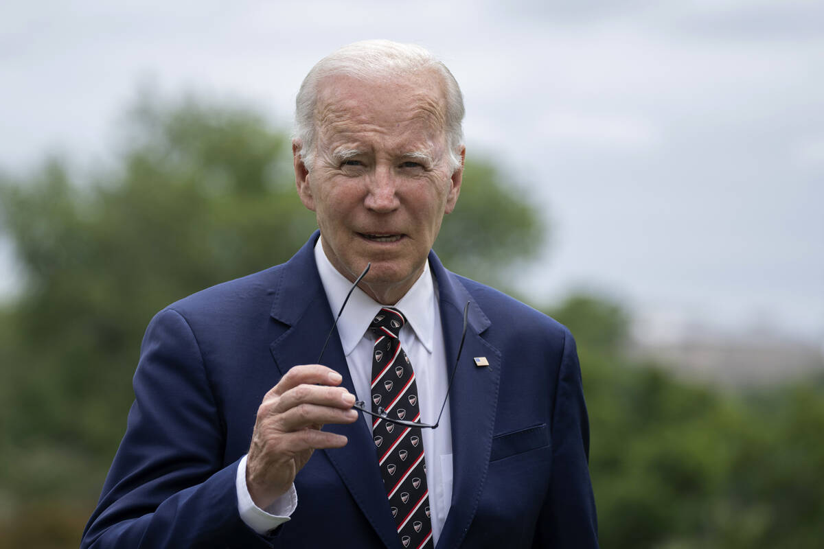 President Joe Biden walks on the South Lawn upon his return to the White House in Washington, S ...