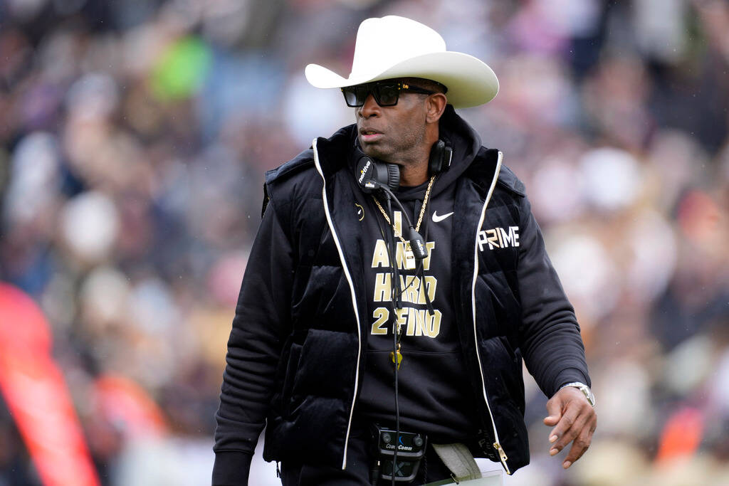 FILE - Colorado head coach Deion Sanders looks on in the first half of the team's spring pract ...