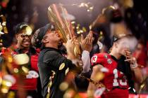 Georgia head coach Kirby Smart kisses the championship trophy after the national championship N ...