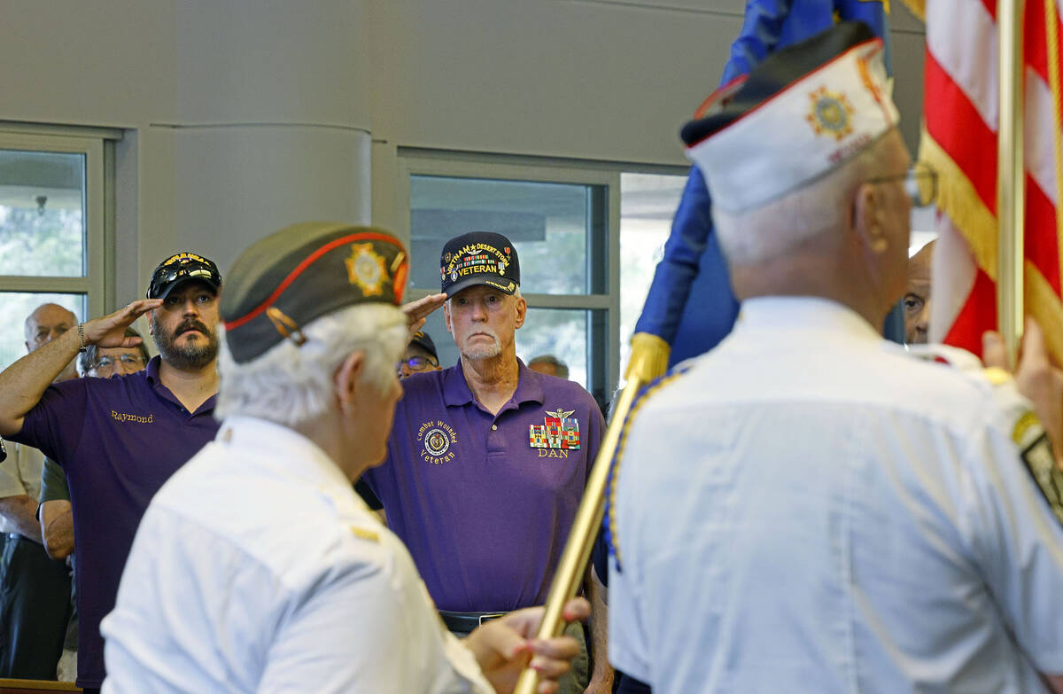 Purple Heart recipients U.S. Marine Corps veteran Raymond Warren , 41, left, and U.S. Army vet ...
