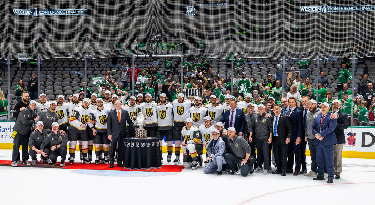 Bill Daly, Deputy commissioner of the NHL, awards the trophy to the Golden Knights after defeat ...